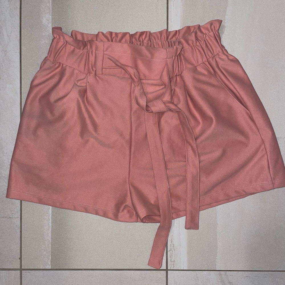Pink shorts, size medium, perfect for elevating a simple outfit